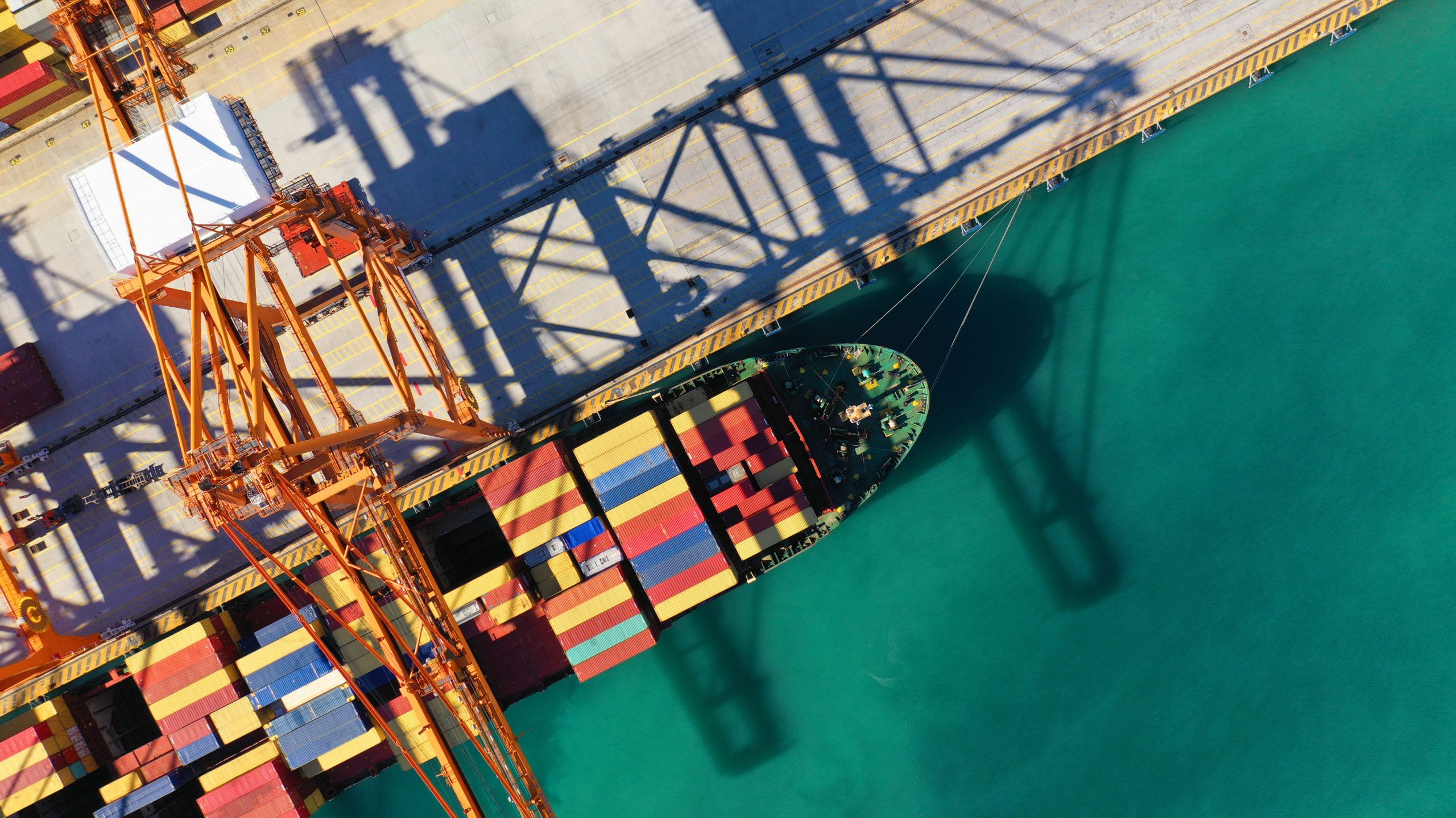 Aerial top down photo of cranes loading - unloading container sh