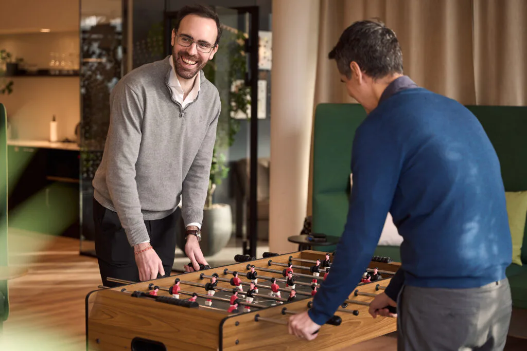 Kezzler team playing foosball