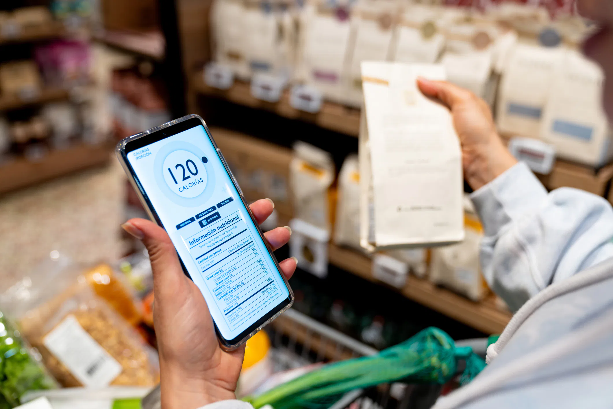 Woman scanning the nutrition label on a product at the supermarket